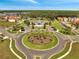 Community center aerial view showing landscape, palms and manicured landscaping with homes in the distance at 2505 Dharma Cir, Kissimmee, FL 34746