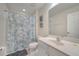 Bathroom featuring a shower with patterned curtain, vanity with mirror and toilet at 2505 Dharma Cir, Kissimmee, FL 34746
