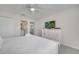 This bedroom features white furniture, neutral walls and carpeted floors with lots of natural light at 2505 Dharma Cir, Kissimmee, FL 34746