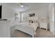 This bedroom features white furniture, neutral walls and carpeted floors with lots of natural light at 2505 Dharma Cir, Kissimmee, FL 34746