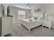Comfortable bedroom with a large window, ceiling fan, carpet, and neutral decor at 2505 Dharma Cir, Kissimmee, FL 34746