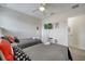 Bright bedroom featuring two beds, ceiling fan and mounted television at 2505 Dharma Cir, Kissimmee, FL 34746