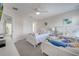 Bright bedroom with twin beds, ceiling fan and carpeted floors offers a cozy space at 2505 Dharma Cir, Kissimmee, FL 34746