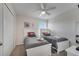 The bedroom features twin beds, ceiling fan and whimsical décor for a fun space at 2505 Dharma Cir, Kissimmee, FL 34746