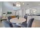 Open dining area with seating for four, adjacent to the kitchen and living spaces at 2505 Dharma Cir, Kissimmee, FL 34746