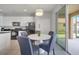 Dining area near the kitchen with a sliding door, seating for four, and natural light at 2505 Dharma Cir, Kissimmee, FL 34746