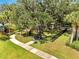 Community dog park surrounded by lush green grass and mature trees providing ample shade at 2505 Dharma Cir, Kissimmee, FL 34746