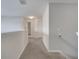 Hallway with carpet and a view to a bathroom and another room at 2505 Dharma Cir, Kissimmee, FL 34746
