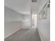 Upstairs hallway with neutral paint and carpet at 2505 Dharma Cir, Kissimmee, FL 34746