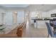 Open floor plan showcasing a living room, kitchen, and dining area with tile flooring at 2505 Dharma Cir, Kissimmee, FL 34746