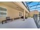 Spacious screened-in patio features a seating area and overlooks the backyard at 2505 Dharma Cir, Kissimmee, FL 34746
