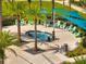Aerial view of community pool and lounge area with shade canopies and seating at 2505 Dharma Cir, Kissimmee, FL 34746