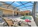 A serene screened-in pool area with lounge chairs and a -safe pool fence enhances outdoor living at 2505 Dharma Cir, Kissimmee, FL 34746