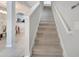 The staircase features neutral carpet and walls, and is directly accessible from the main entrance at 2505 Dharma Cir, Kissimmee, FL 34746