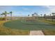 Community basketball court with green surface and view of lake at 2769 Bookmark Dr, Kissimmee, FL 34746