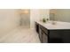 Spacious bathroom with dual sinks, walk-in shower, and sleek modern design at 2769 Bookmark Dr, Kissimmee, FL 34746