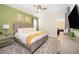 Comfortable bedroom with a king-size bed, soft lighting, and neutral tones at 2769 Bookmark Dr, Kissimmee, FL 34746