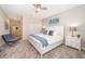 Cozy bedroom with a king-size bed, plush carpeting, and stylish decor at 2769 Bookmark Dr, Kissimmee, FL 34746