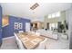 Elegant dining area with a contemporary chandelier, open to the kitchen and living spaces at 2769 Bookmark Dr, Kissimmee, FL 34746
