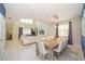 Open-concept dining and living areas with high ceilings and elegant decor at 2769 Bookmark Dr, Kissimmee, FL 34746