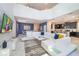 Bright living room featuring a high ceiling, modern decor, and sleek furniture at 2769 Bookmark Dr, Kissimmee, FL 34746