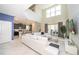 Bright and spacious living room with a modern design, open to the kitchen and dining areas at 2769 Bookmark Dr, Kissimmee, FL 34746