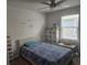 bedroom with a bed, storage, and playful wall art at 2927 Windmill Dr, Kissimmee, FL 34741