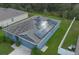 Aerial view of a house with solar panels on the roof and a well-manicured lawn at 3617 Scarlet Oak Dr, St Cloud, FL 34772