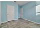 Bedroom featuring painted walls, tile flooring, and entry doors at 3617 Scarlet Oak Dr, St Cloud, FL 34772