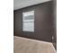 This bedroom offers a window with blinds and neutral tile flooring at 3617 Scarlet Oak Dr, St Cloud, FL 34772