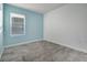 Bedroom showcasing neutral walls, tile flooring, and a window at 3617 Scarlet Oak Dr, St Cloud, FL 34772
