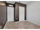 This bedroom showcases neutral tile flooring, two closets, and a neutral color scheme at 3617 Scarlet Oak Dr, St Cloud, FL 34772