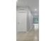 Hallway showcasing ceramic tile flooring, neutral walls, and ample lighting fixtures at 3617 Scarlet Oak Dr, St Cloud, FL 34772