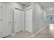 Hallway with multiple doors leading to different rooms at 3617 Scarlet Oak Dr, St Cloud, FL 34772