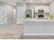 Modern kitchen equipped with stainless steel appliances, ceramic tile flooring, and breakfast bar at 3617 Scarlet Oak Dr, St Cloud, FL 34772