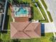 Aerial view showing home with pool and screen enclosure, plus surrounding neighborhood at 4610 Salamander St, St Cloud, FL 34772