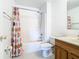 Bathroom with shower/tub combo and colorful curtain at 4610 Salamander St, St Cloud, FL 34772