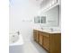 Double vanity bathroom with a large soaking tub at 4610 Salamander St, St Cloud, FL 34772