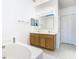 Double vanity bathroom with a large soaking tub at 4610 Salamander St, St Cloud, FL 34772