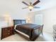 Bedroom with dark wood furniture and ceiling fan at 4610 Salamander St, St Cloud, FL 34772