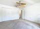 Guest bedroom with ceiling fan and double door closet at 4610 Salamander St, St Cloud, FL 34772