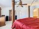 Main bedroom with a four-poster bed and ensuite bathroom access at 4610 Salamander St, St Cloud, FL 34772
