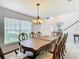 Formal dining room with a large wood table and six chairs at 4610 Salamander St, St Cloud, FL 34772