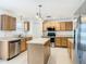 Modern kitchen with stainless steel appliances and an island at 4610 Salamander St, St Cloud, FL 34772