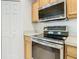 Kitchen with stainless steel appliances and wood cabinets at 4610 Salamander St, St Cloud, FL 34772