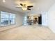 Spacious living room with carpeted floors and large windows at 4610 Salamander St, St Cloud, FL 34772