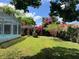 Spacious yard with pool, pergola and beautiful flowering trees at 112 10Th St, St Cloud, FL 34769