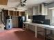 Attached garage with lots of room for storage, including refrigerator, cabinets, and an updated water heater at 112 10Th St, St Cloud, FL 34769