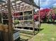 The backyard features a custom-built raised garden bed framed by a wooden structure at 112 10Th St, St Cloud, FL 34769