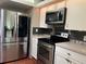 Modern kitchen featuring stainless steel appliances and plenty of storage at 112 10Th St, St Cloud, FL 34769